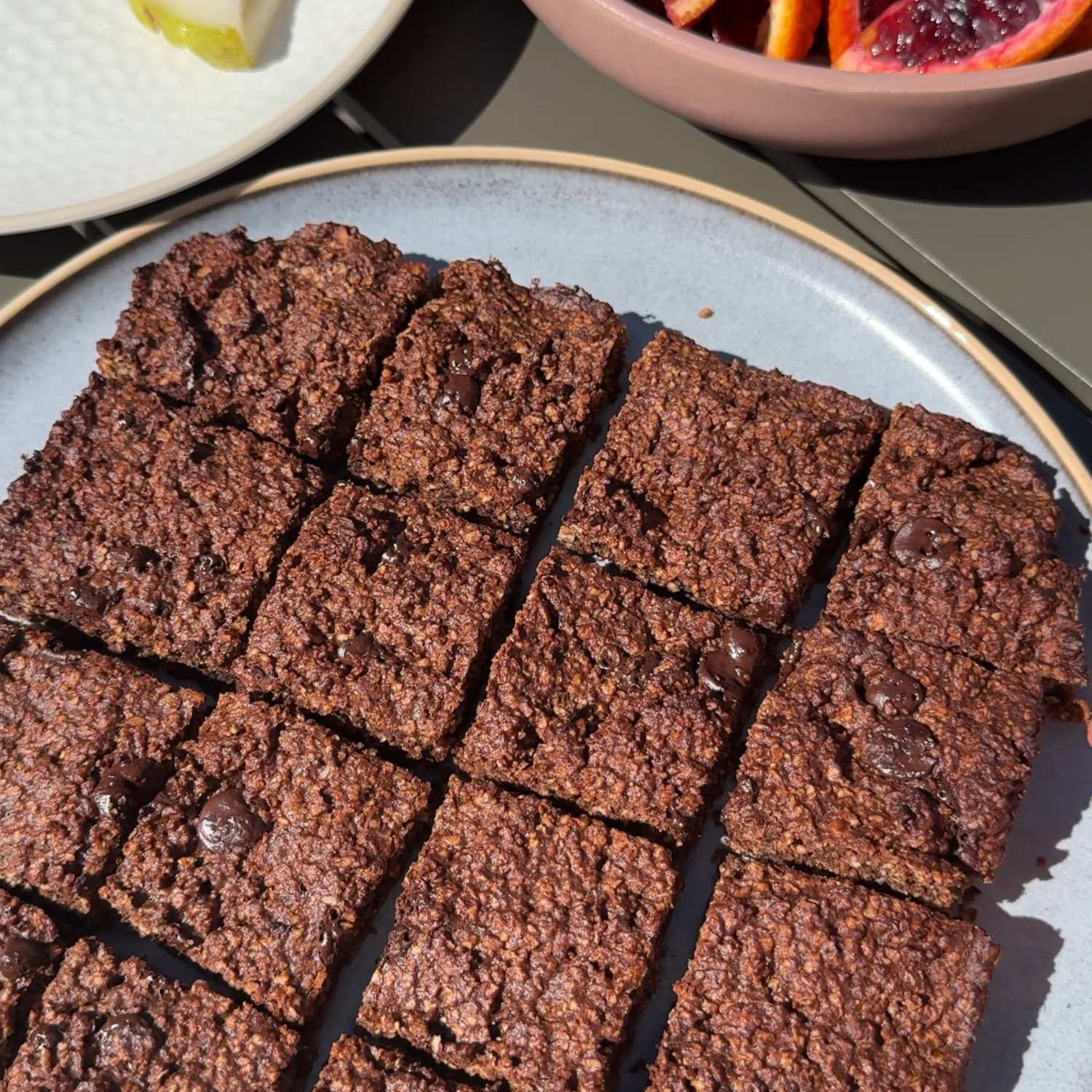 A fudgy oat brownie made with SaweetWay allulose served on a plate, with a dense, rich texture and glossy top